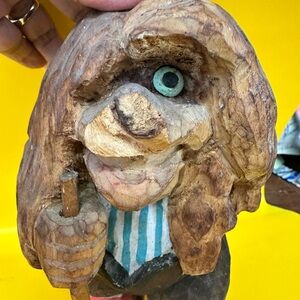 Hand-Carved Wooden Figurine with Blue Accents